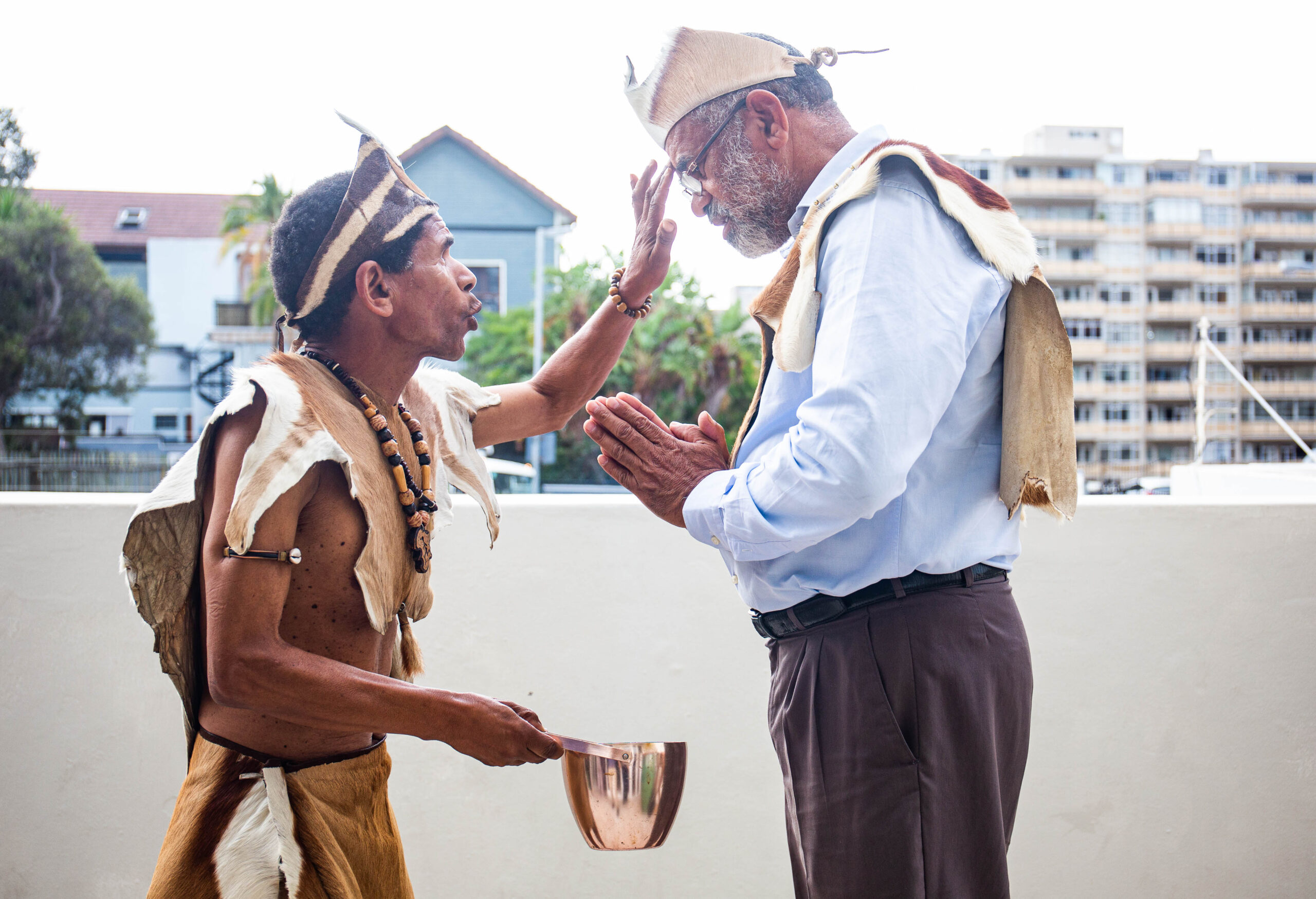 Khoisan community preparing for prayer by Chief Autshumao Mackie.